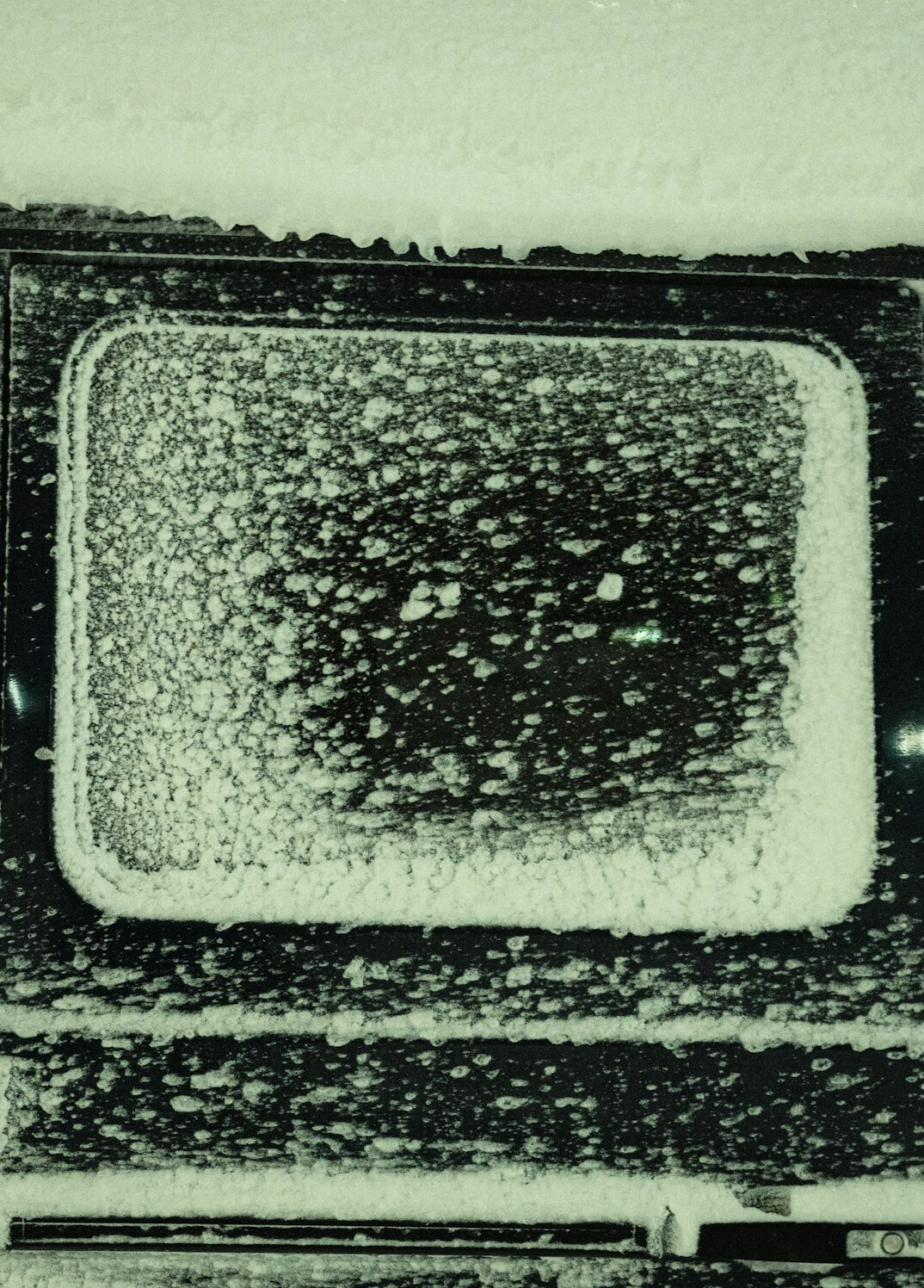 Close-up of a vintage television screen with soft static texture